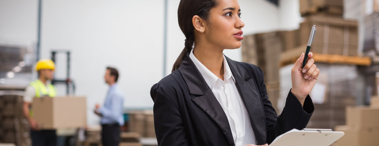 Woman checking inventory in warehouse