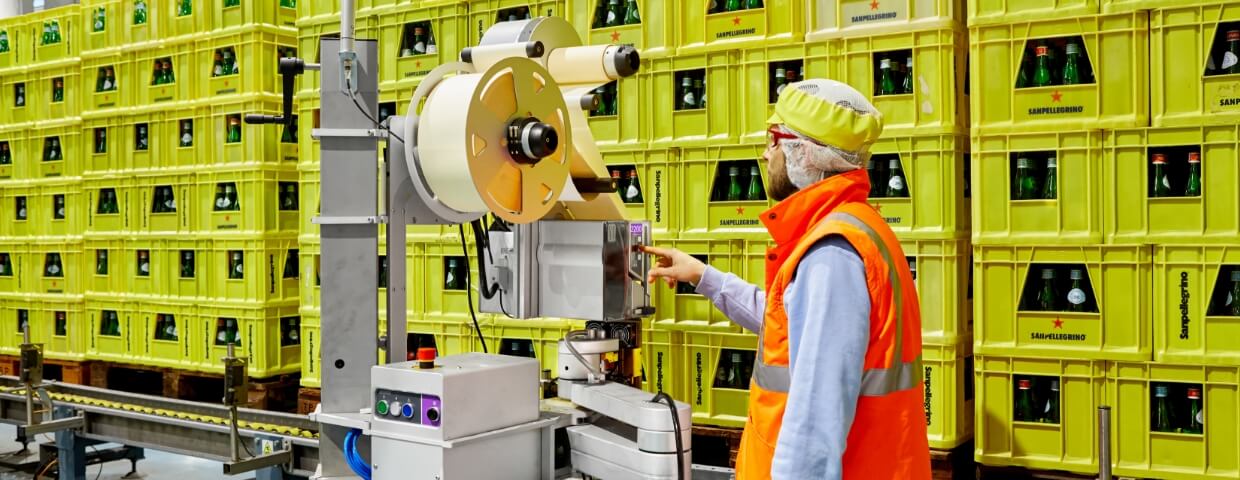 Man working label printer machine