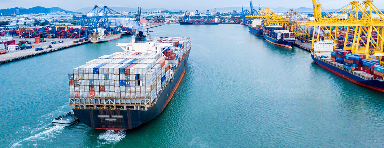 Barge of metal containers in harbor