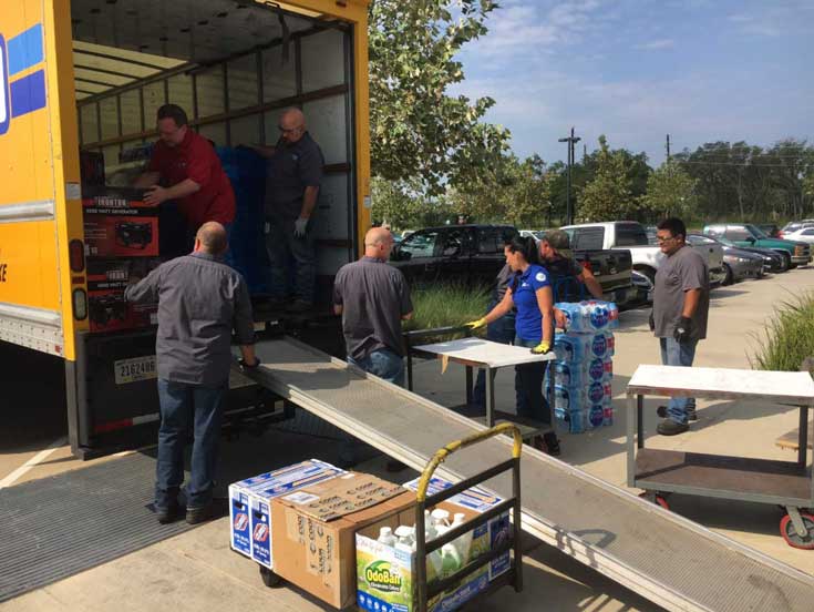 Dover team members unloading supplies for Hurricane Harvey victims