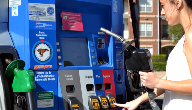 Woman operating a fueling pump