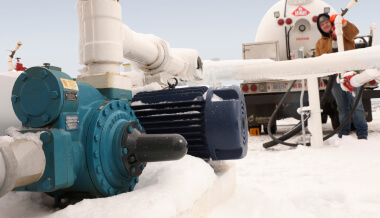 Man working with pumps in arctic environment