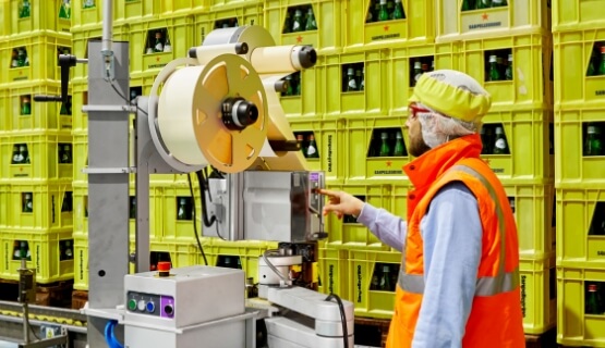 Man working on label printer machine