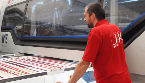 Man working on label printer machine